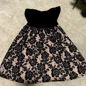 I am selling to get some clothes out of my closet! Great little black dress.